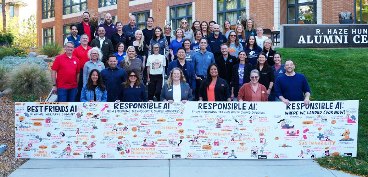 Best Friends AI in Animal Welfare Summit attendees behind a banner