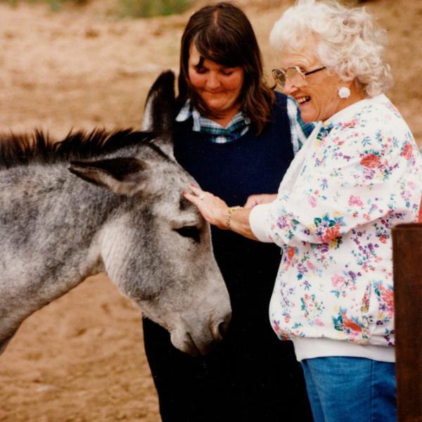 Co-founder Faith Maloney with Dolores Harris who, with her husband Homer, were instrumental in funding projects at Best Friends in the early days. (With burro Sunshine, rescued from the Grand Canyon).