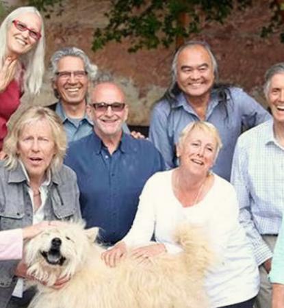 founders together in canyon with white dog