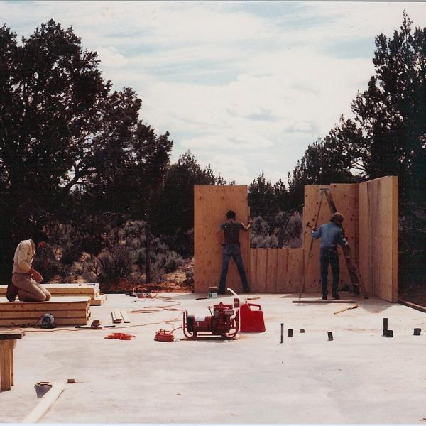 Co-founder Gregory Castle helps build the original Bunkhouse, 1984