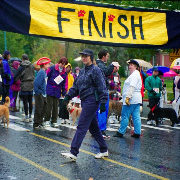 Julie Castle inspects the scene before Strut Your Mutt participants are given the signal to start, 1996.