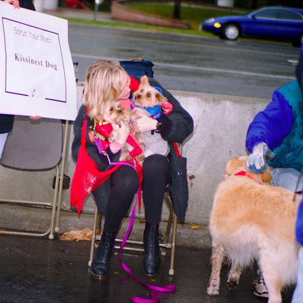 Two pups try to prove they are the ‘kissinest’ at Strut Your Mutt, 1996.