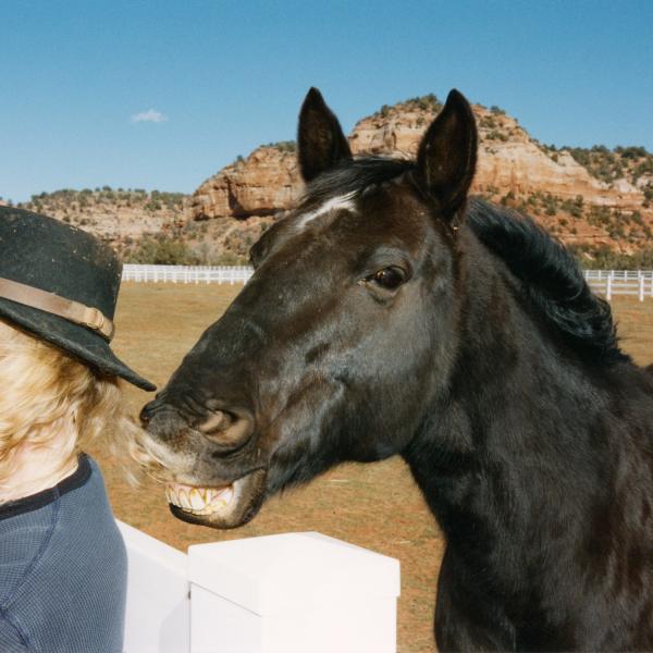 Harley smiles mischievously behind co-founder Diana Asher.