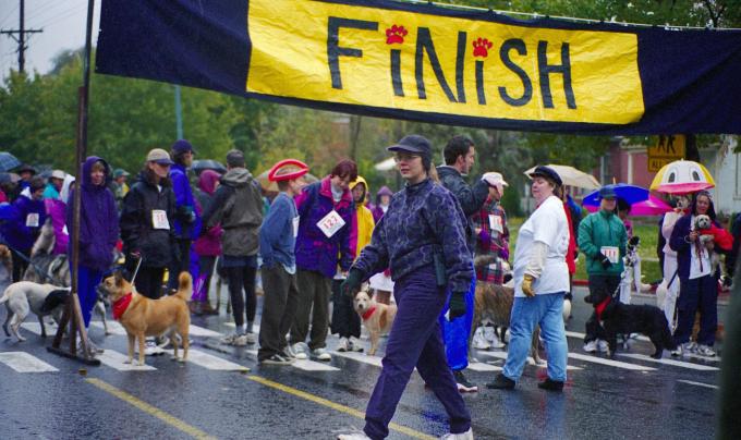 Julie Castle bundled up in warm clothing at the finish line of the first-ever Strut Your Mutt event