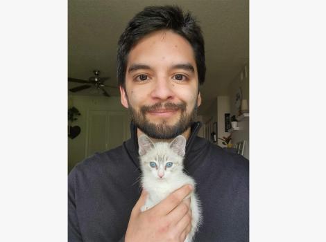Justin Serna holding a kitten