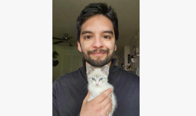 Justin Serna holding a kitten