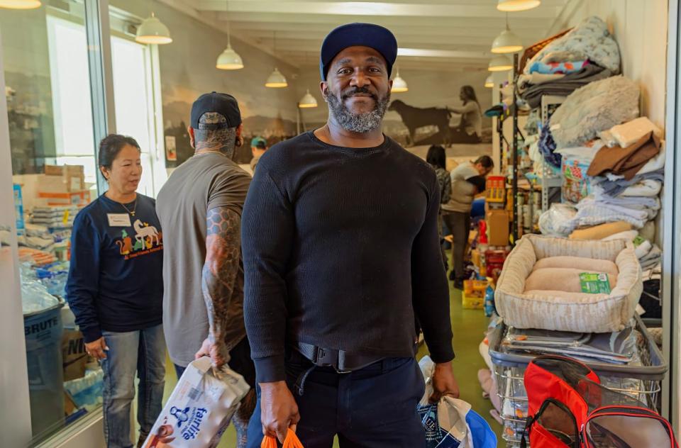Community member helping with shelter donations.