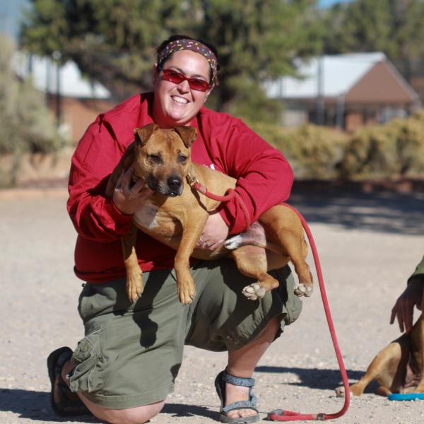 Oscar and Squeaker calmly enjoy their time with Best Friends staff members.